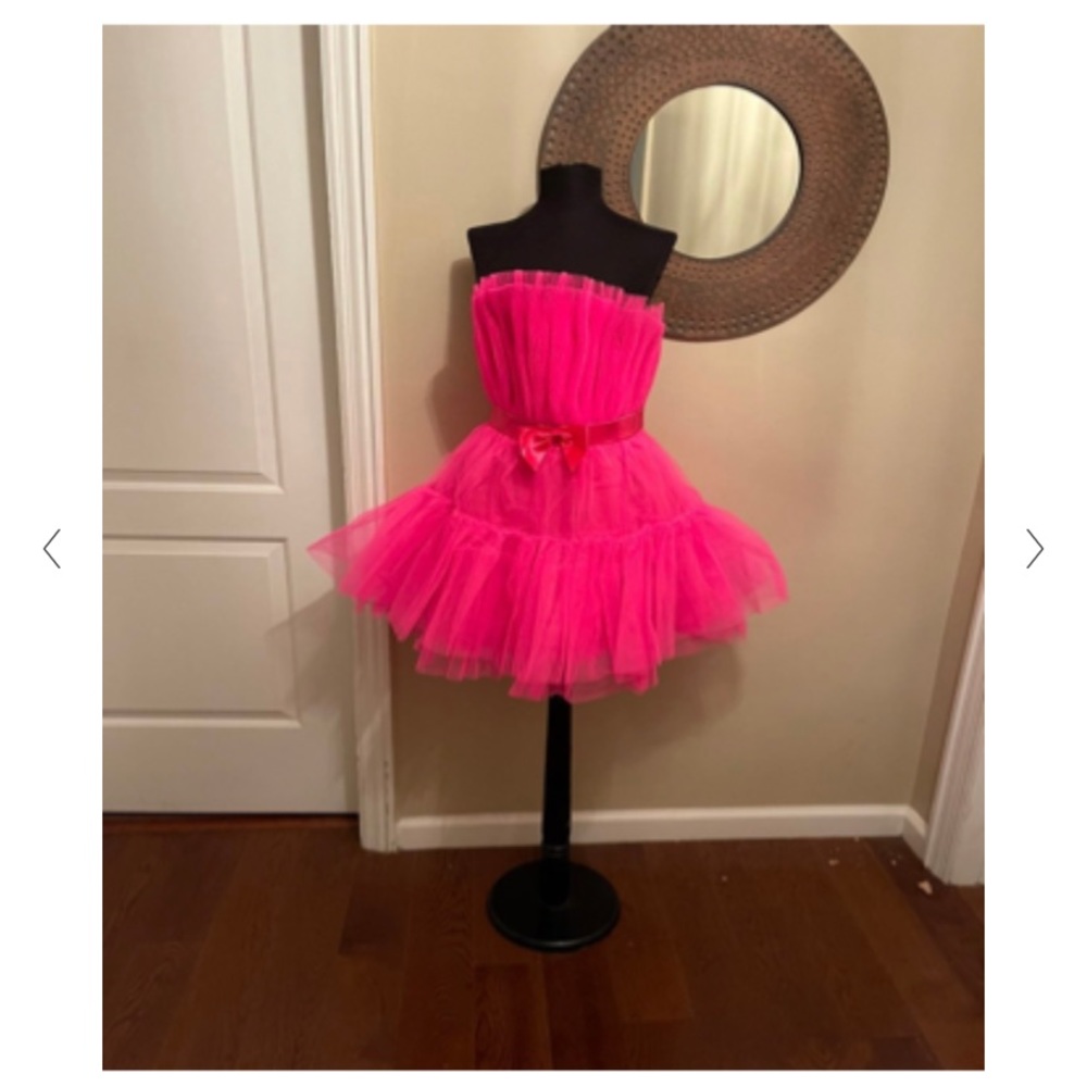 Hot pink, strapless, tulle, cocktail dress with bow belt.